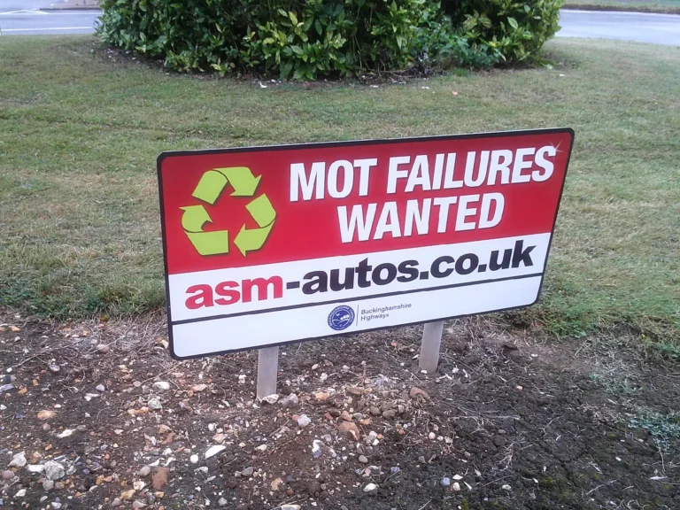 Buckinghamshire roundabout sponsorship sign for ASM Autos